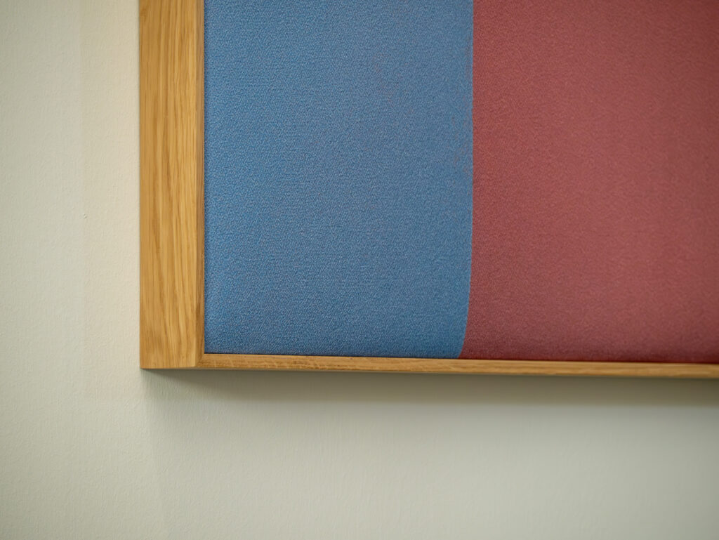 Close-up on Dezibel Art, acoustic art panel with artwork from Paper Collective.